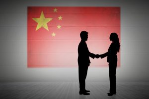 BLOG 41 composite image silhouette business people shaking hands